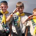 Kids in uniform by tent