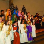 Elemetary Students singing and wearing Bible costumes.